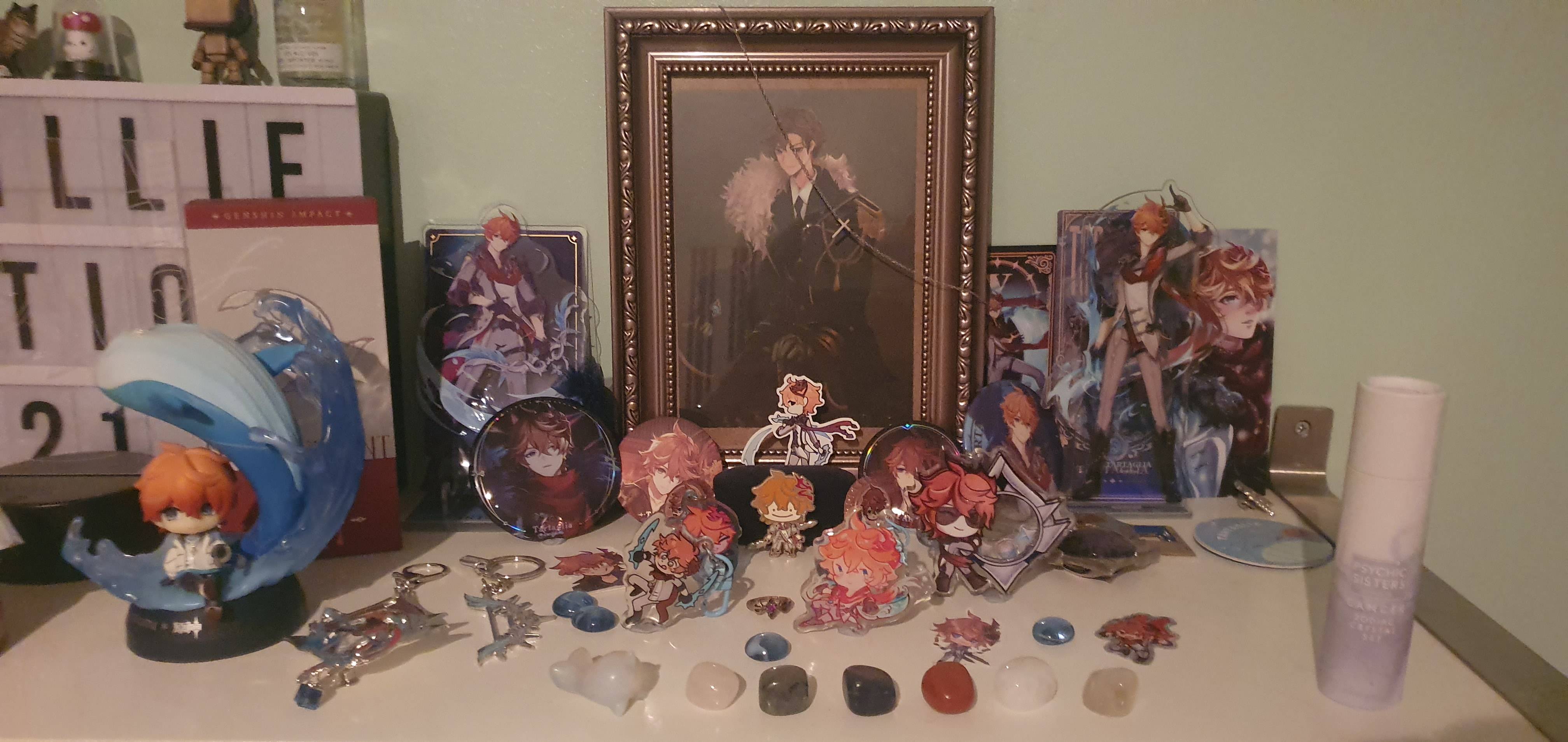 my main irl shrine, formed of most of the items i've collected over the years